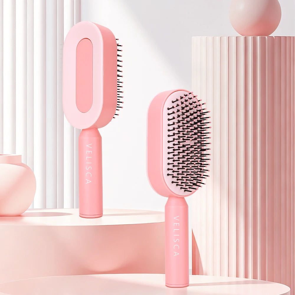 Velisca Bürste in Rosa von beiden Seiten: Rückseite mit Druckknopf und Borstenseite